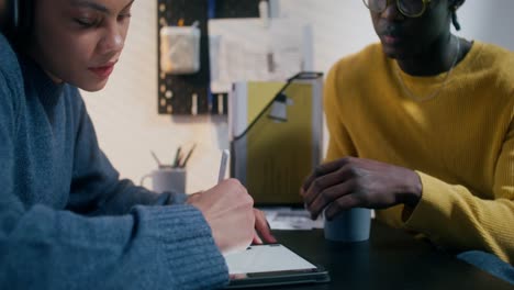 two young people collaborating on a project