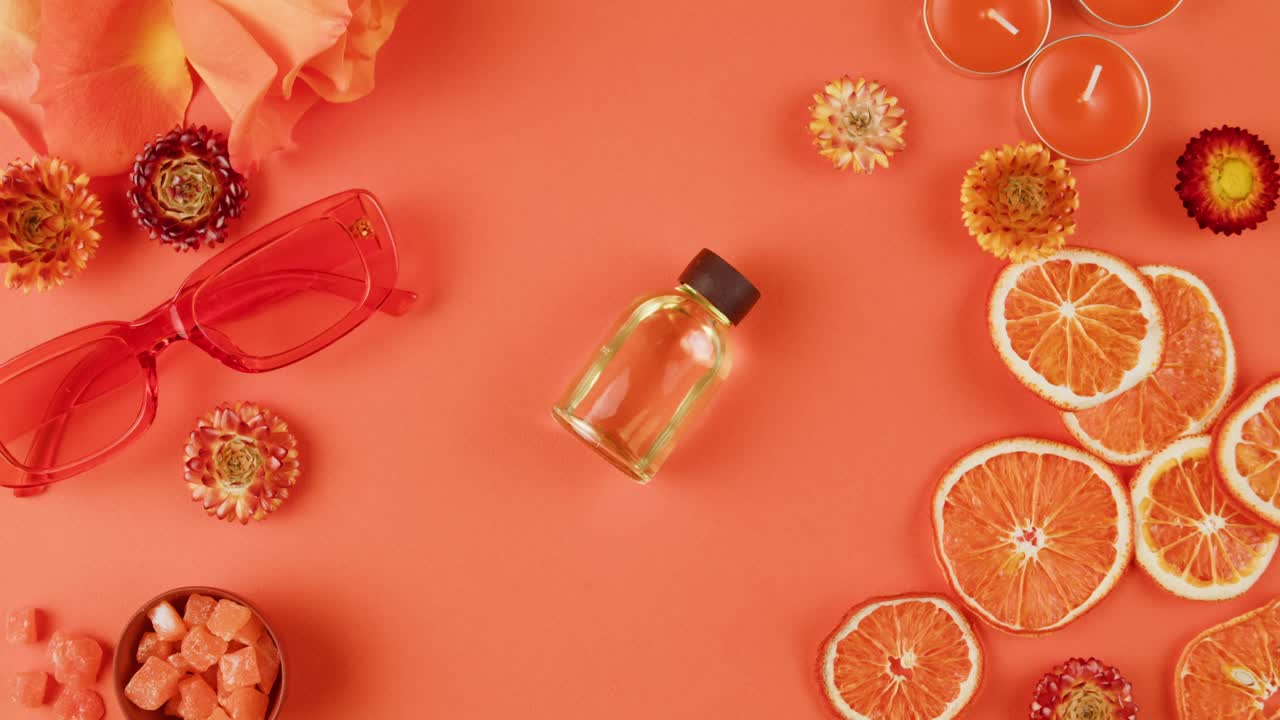 Orange-Themed Perfume and Accessories Flat Lay