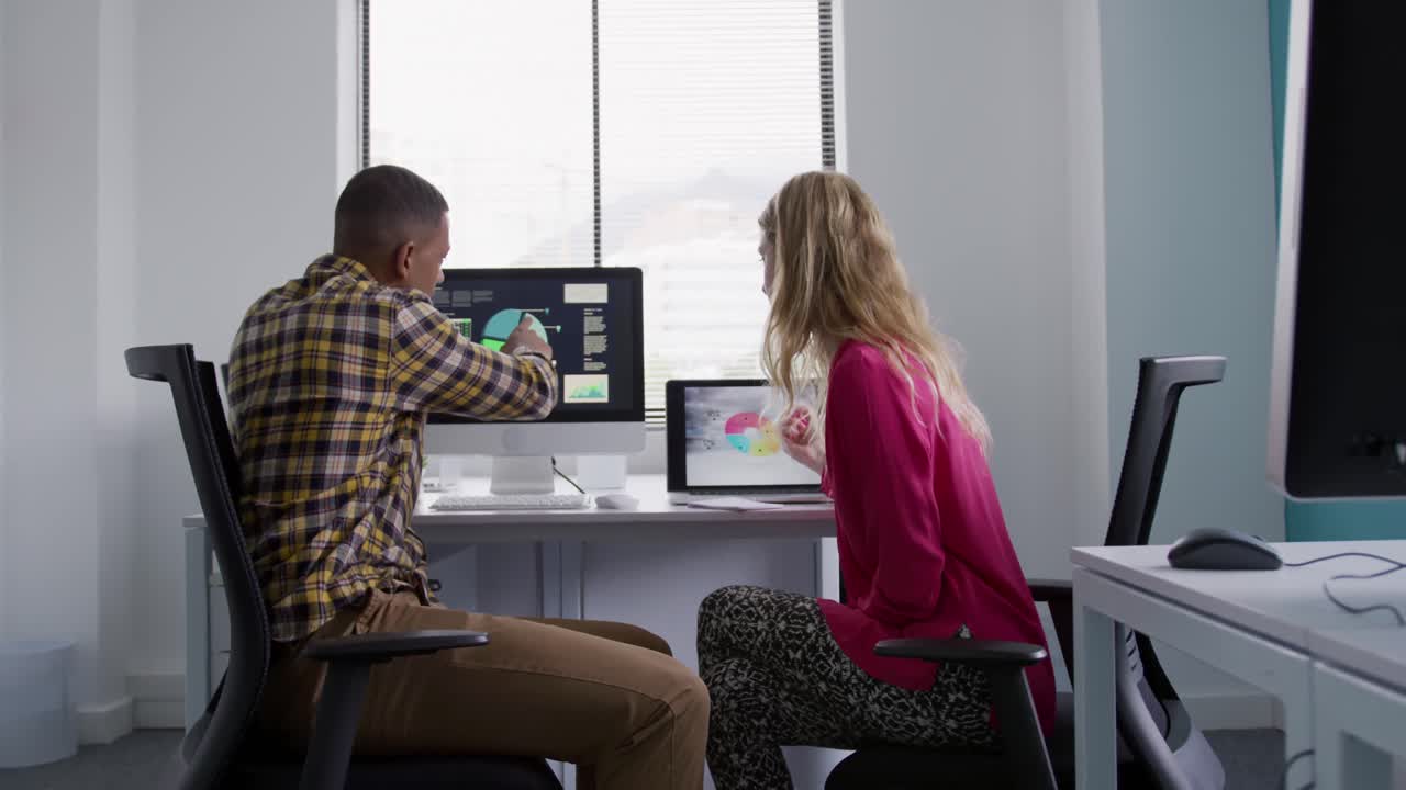 man and woman working on computers