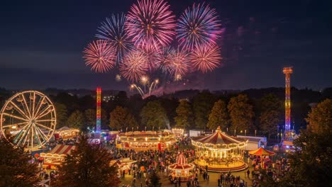 nighttime carnival with fireworks and rides