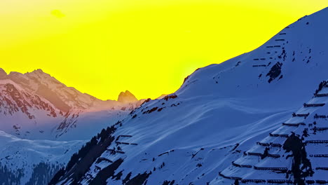 Panoramic-view-of-the-mountain-with-the-rest-of-its-mountain-range-with-moving-clouds-and-sun-in-the-background-with-a-shadow