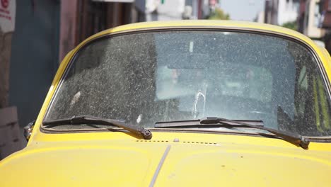 dirty yellow vintage vw beetle