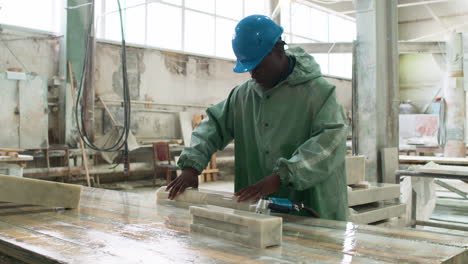 man polishing marble