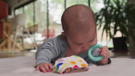 Cute-baby-teething-on-toy