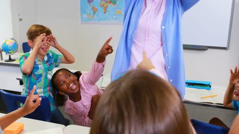 School-kids-irritating-teacher-in-classroom