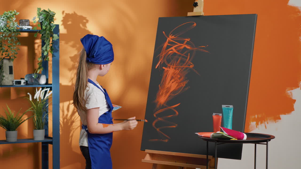 Young Girl Painting on Canvas in Art Studio