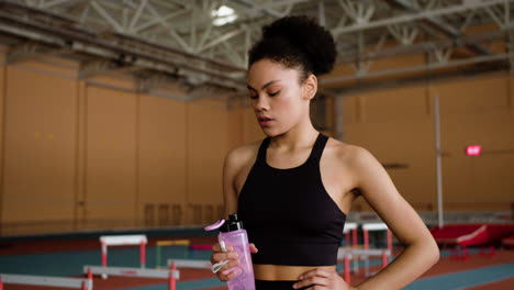 young woman drinking water