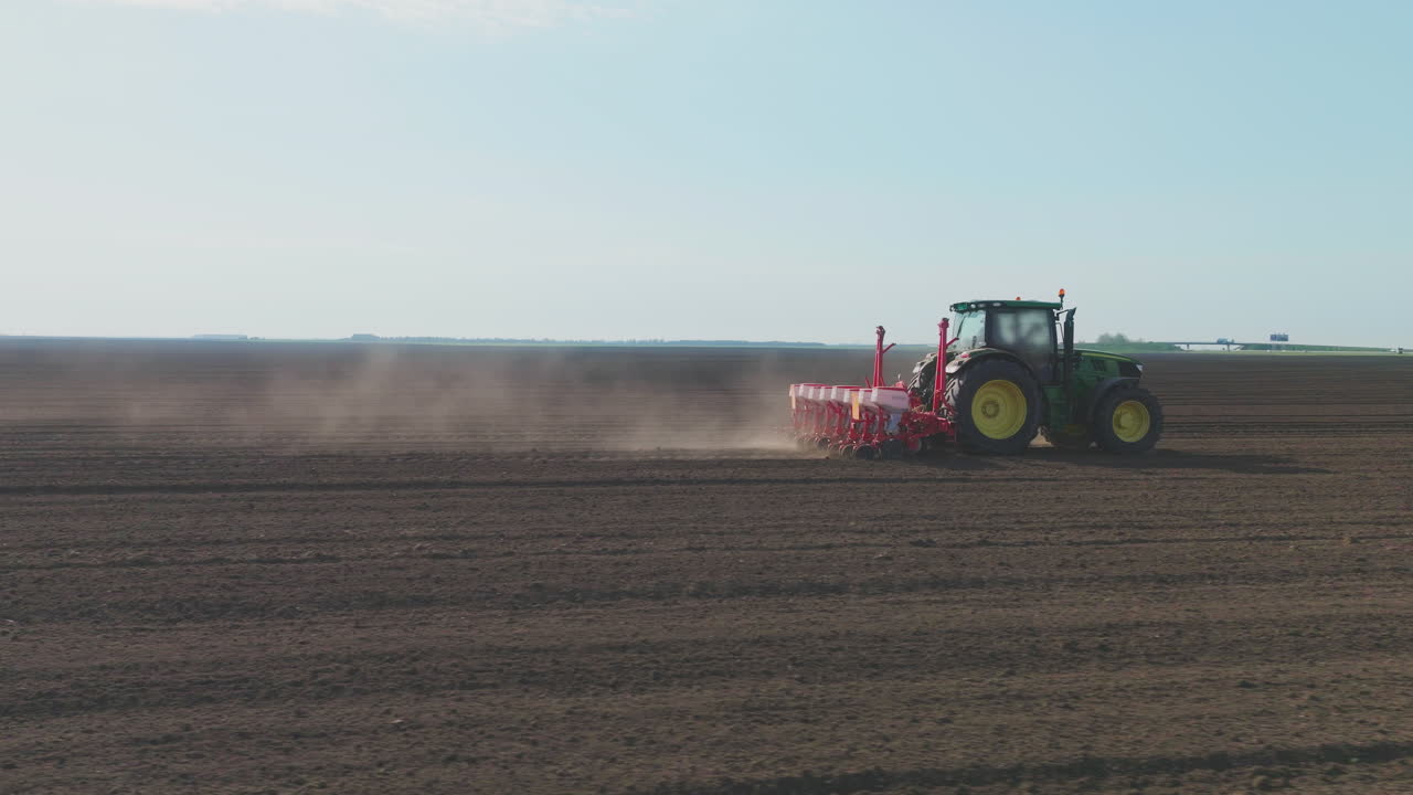 Tractor Planting Crops in a Field