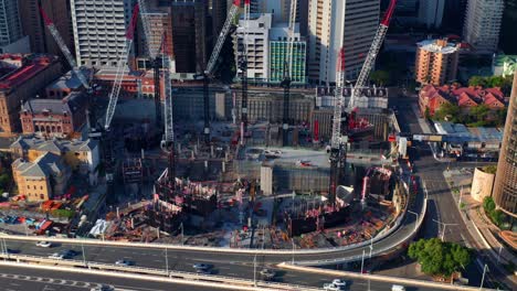 traffic driving in the motorway passing by queen's wharf under construction in qld, australia