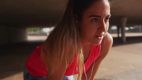 Caucasian-woman-working-out-under-a-bridge