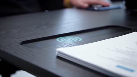 innovative workspace: a close-up of a modern desk featuring interactive technology, papers, and a sleek design perfect for efficient productivity