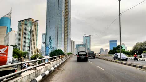 jakarta, indonesia freeway overpass. skyscraper high rise