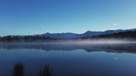 lake mist with mountains and forest timelapse enid british columbia canada