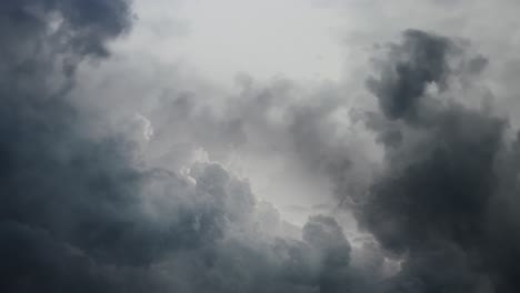 thunderstorm in moving clouds in dark sky 4k