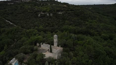 -shot [orbit plane or point of interest]
-description [drone video about a monastery in the valleys and mountains of provence-alpes-côte d'azur in france near buoux