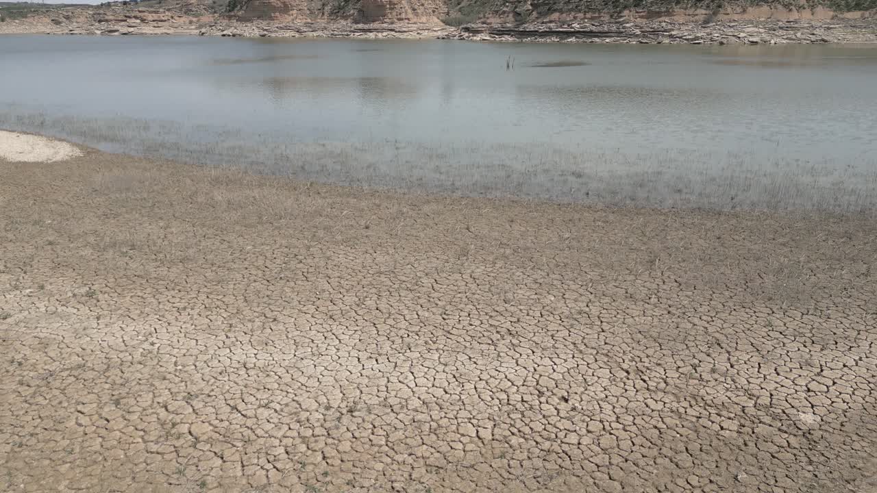 Drone view of arid bottom of drying out river. Ebro river in Spain
