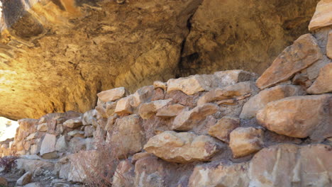 remnants of wall of cliff dwelling at walnut canyon