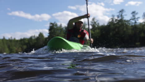 kayak athlete paddling in the water close up