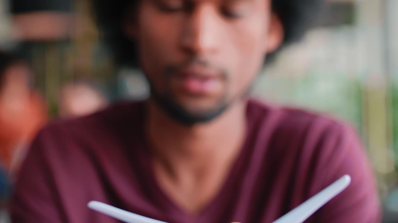 Model of wind turbine in man's hands