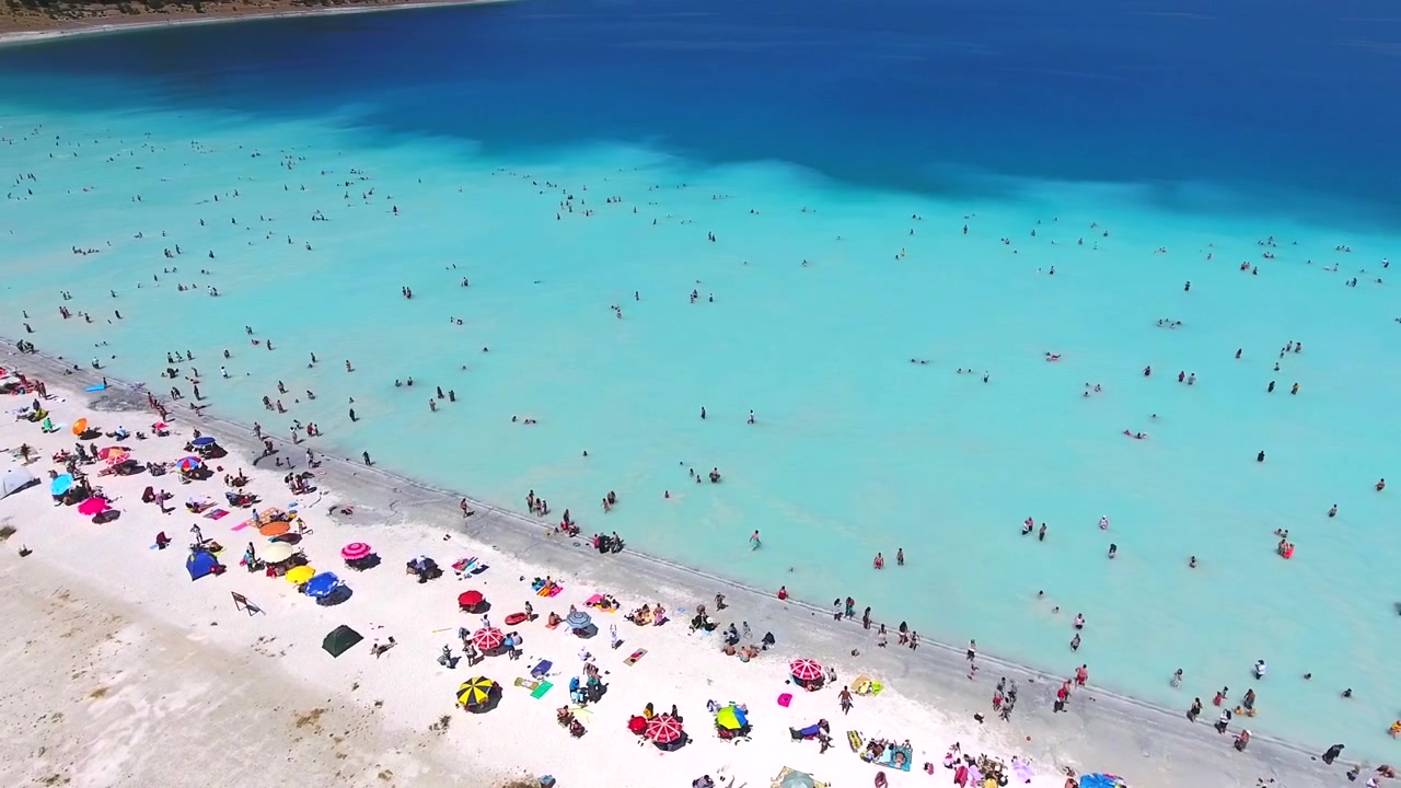 Aerial View of Crowded Beach with Turquoise Water