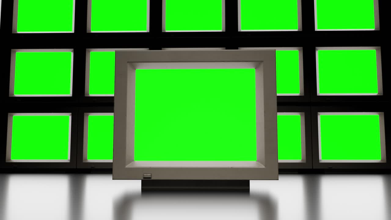 Set of retro TVs with green screen in dark studio