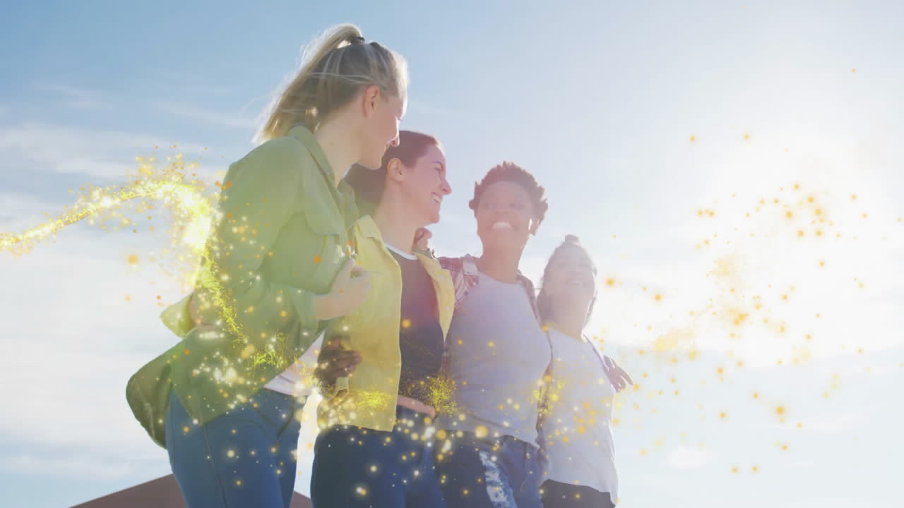 female team linking arms outdoors, swirling golden spark highlighting marketing growth