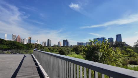benjakitti park bangkok thailand green space city building skyline nature landscape