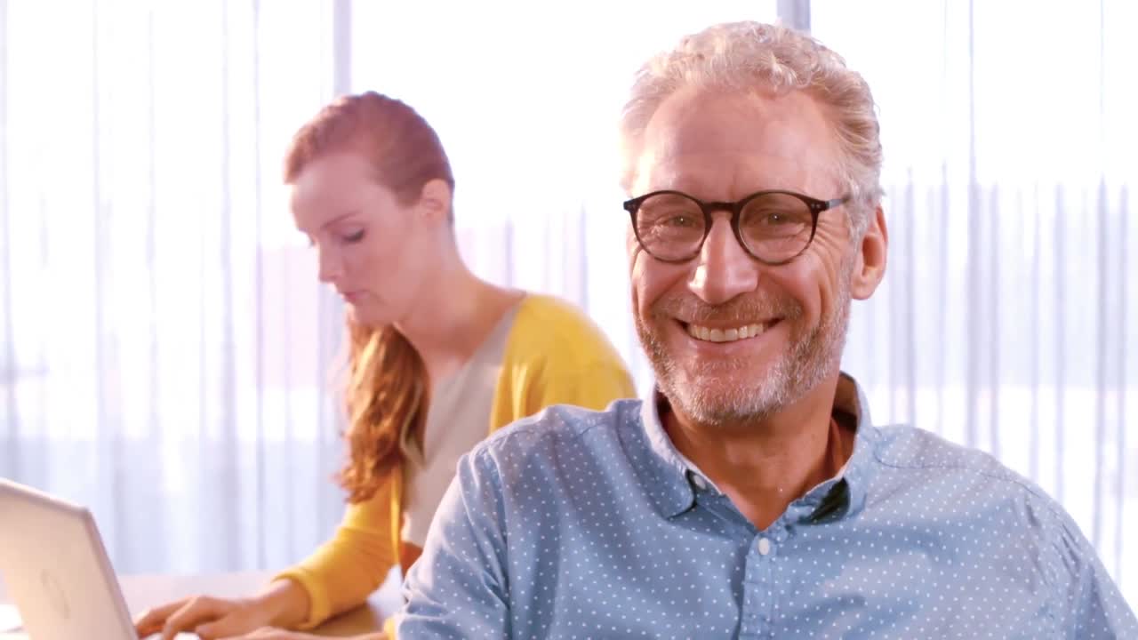 Businessman smiling in office