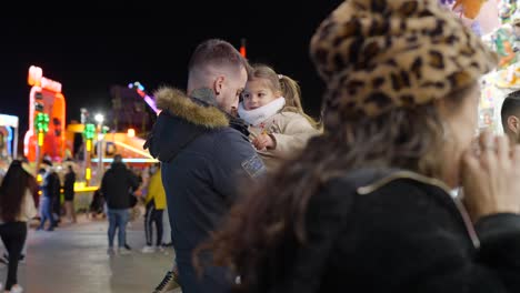 father and daughter at a winter fair