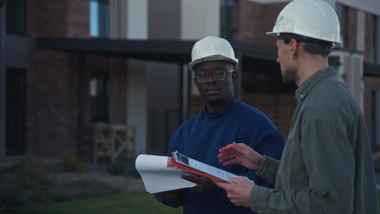 Construction Workers Discussing Project on Site