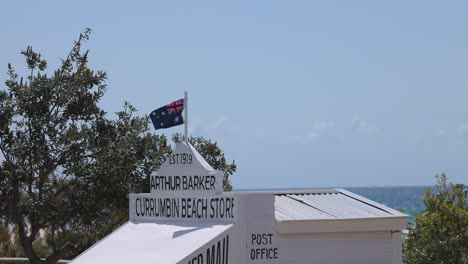 australian flag waving at currumbin beach store