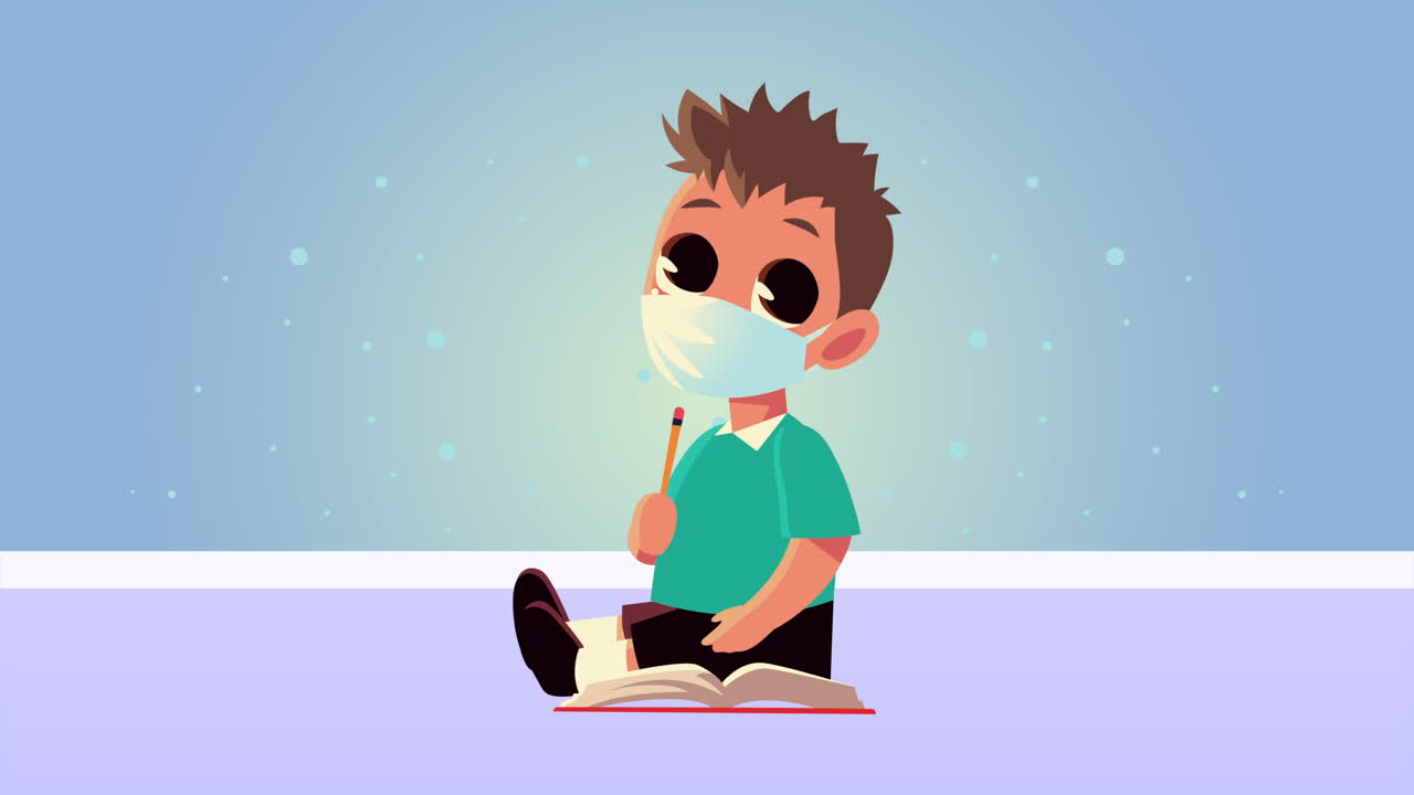 niño estudiante con máscara médica sentado con un libro