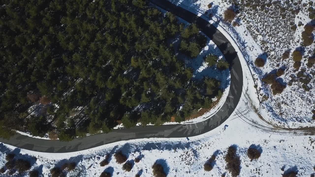 Aerial view of a road in the snowed moutains