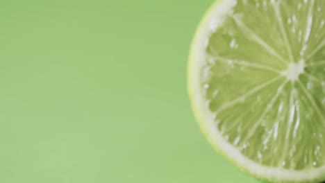 Video-of-sliced-lime-with-copy-space-over-green-background