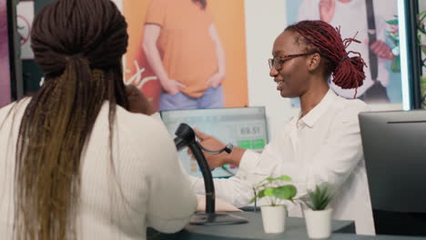 Woman-buys-clothes-at-checkout-counter