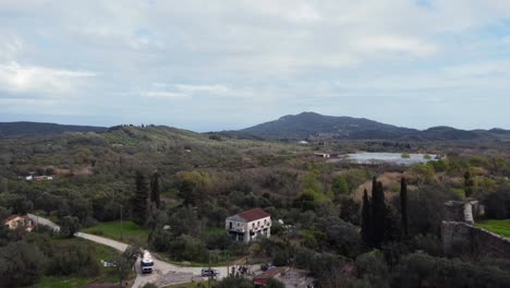 Gorgeous-aerial-view-flight-slowly-sinking-down-drone-footage-over-street-drive-a-cement-mixer-truck-at-Corfu-the-explorer-island-in-Greece-4k-Cinematic-view-from-above-by-Philipp-Marnitz-spring-2022