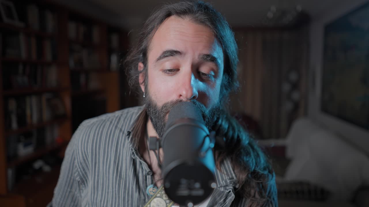 Man Singing into a Microphone at Home