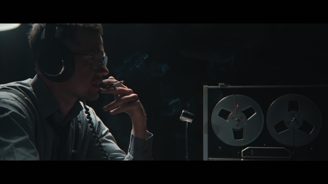 An intelligence officer listens to the wiretap recordings