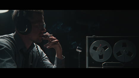 an intelligence officer listens to the wiretap recordings