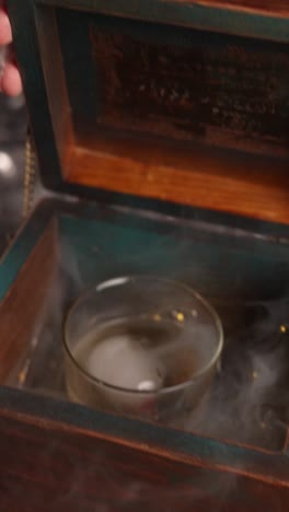 elegant cocktail in decorative wooden box