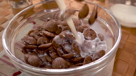Crispy-chocolate-flakes-in-a-bowl-for-a-morning-delicious-breakfast-with-milk.-Slow-motion-with-rotation-tracking-shot.