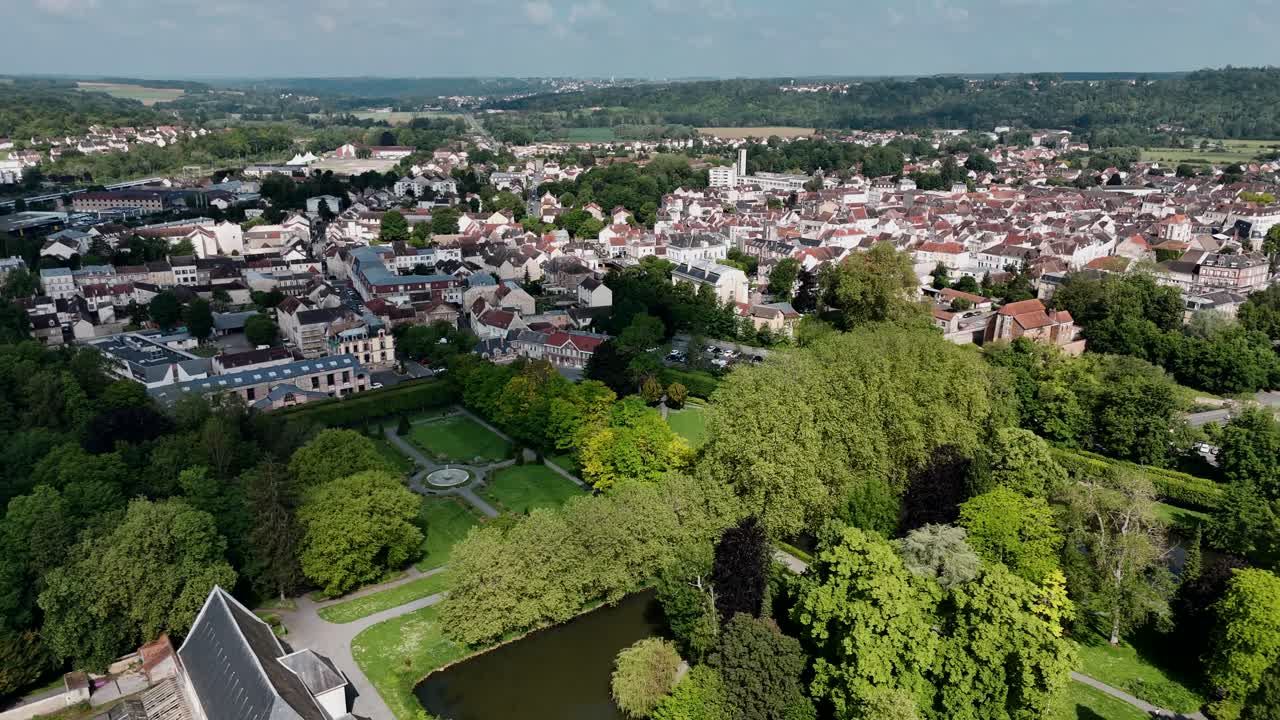 Drone view of Coulommiers city with lush green Parc des Capucins in France
