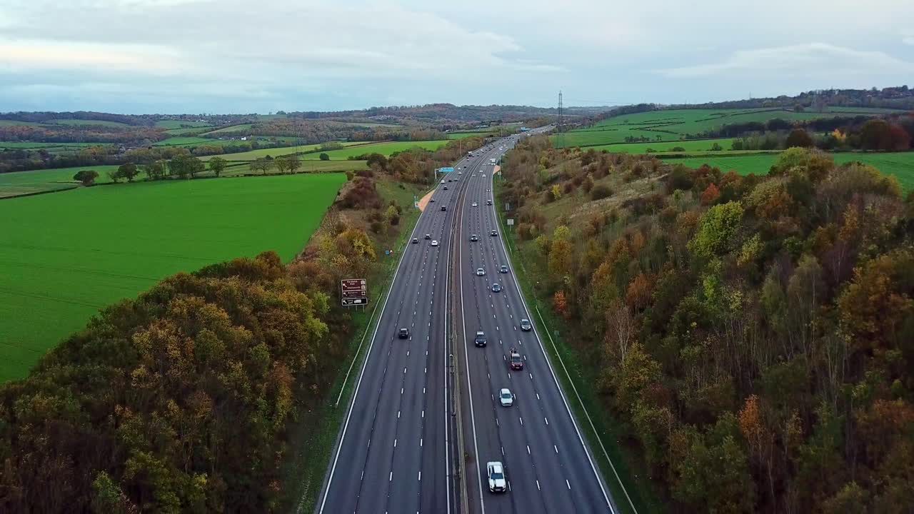 Drone shot above M1 Motorway in the UK around Junction 29 looking south tilting panning down top to bottom