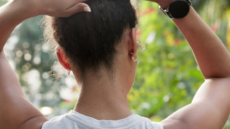 Fitness,-hair-tie-and-nature-runner-in-park