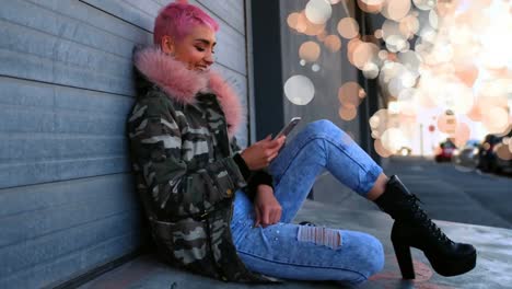 Woman-using-her-mobile-phone-surrounded-by-orange-bubbles-effect