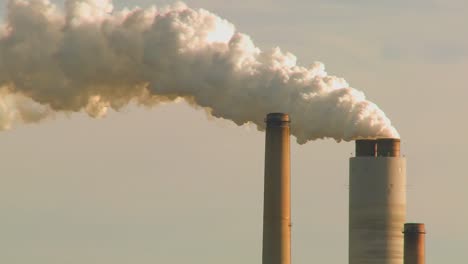 A-power-plant-with-smokestacks-belches-smoke-into-the-air-2