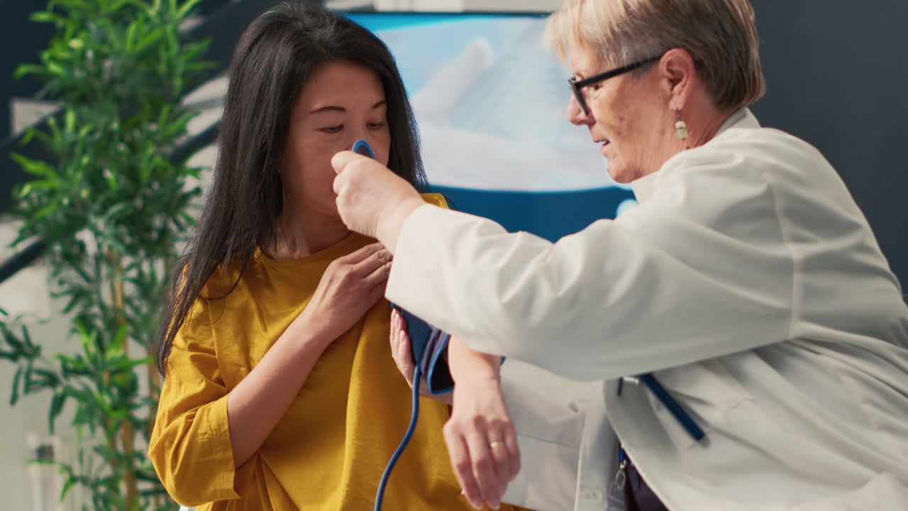 Doctor taking blood pressure of patient