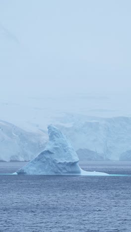 Big-Iceberg-Ice-Formation-Scenery,-Antarctica-Glacier-Winter-Landscape,-Antarctic-Peninsula-Nature-with-Winter-Ocean-Water-in-Vertical-Video-for-Social-Media,-Instagram-Reels-and-Tiktok