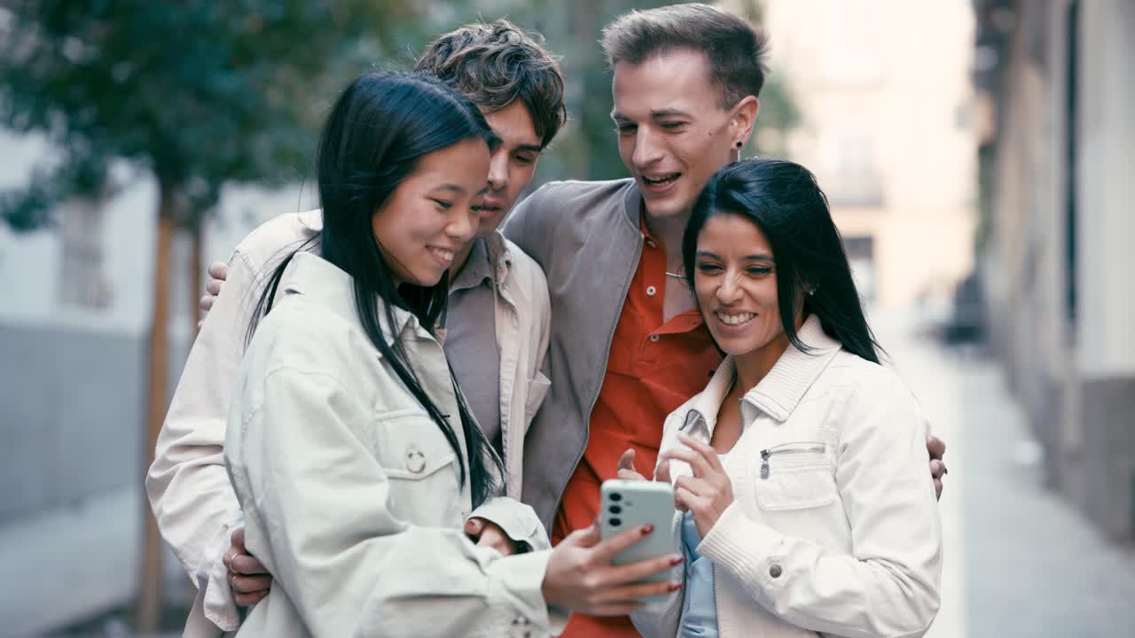 Friends Laughing at Something on a Smartphone