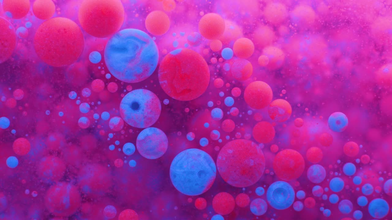 Slow Motion Bright Neon Color Bubbles Oil Beautiful Fluorescent Paint Sparkling Color Moving Multicolor Close up. Acrylic Neon Paint. Fantastic Surface. Abstract Colorful Transformation Gravitation.